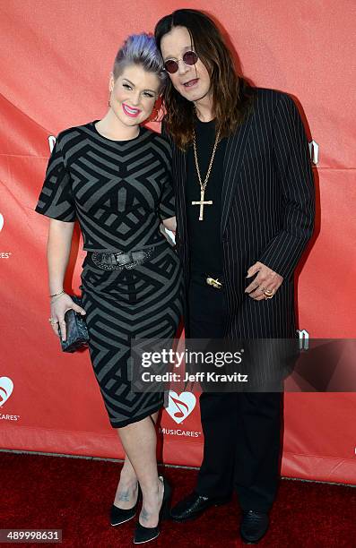 Kelly Osbourne and Ozzy Osbourne arrives at the 2014 10th annual MusiCares MAP Fund Benefit Concert at Club Nokia on May 12, 2014 in Los Angeles,...