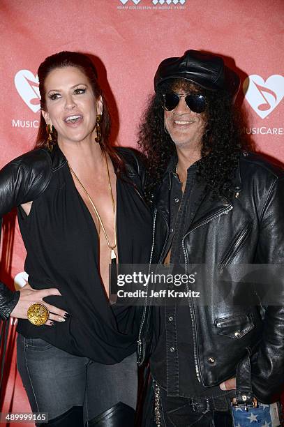 Perla Hudson and Slash arrives at Club Nokia on May 12, 2014 in Los Angeles, California.