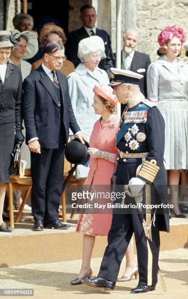 Queen Elizabeth II and Lord Mountbatten, 1st Earl of Burma, at Carisbrooke Castle on the Isle of Wight as he is installed as Governor on 26th July...