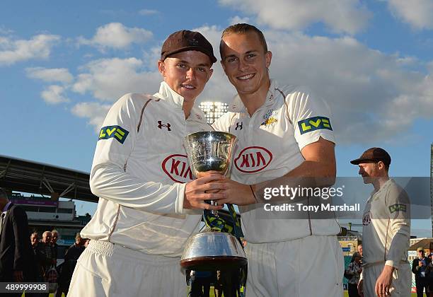 Sam and Tom Curran of Surrey celebrate with the trophy after winning of the Division 2 LV County Championship during the LV County Championship -...