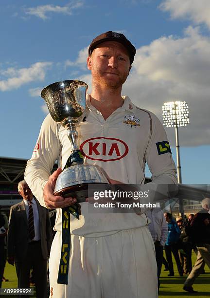 Gareth Batty of Surrey celebrates with the trophy after winning of the Division 2 LV County Championship during the LV County Championship - Division...