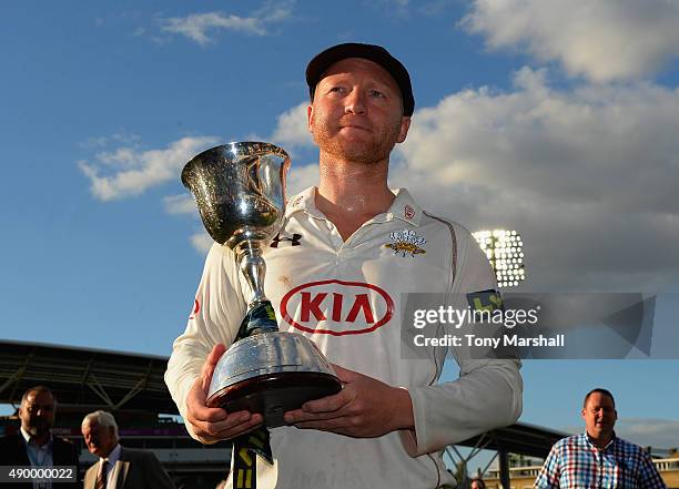 Gareth Batty of Surrey celebrates with the trophy after winning of the Division 2 LV County Championship during the LV County Championship - Division...