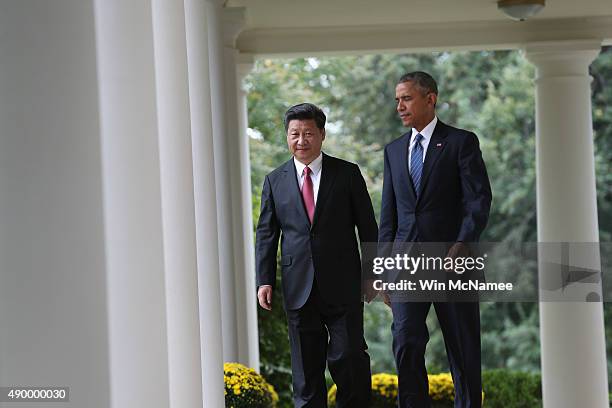 President Barack Obama and Chinese President Xi Jinping arrive for a joint press conference in the Rose Garden at The White House on September 25,...