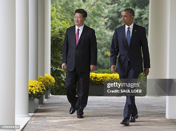 President Barack Obama and Chinese President Xi Jinping arrive for a joint-press conference in the Rose Garden as part of a State Visit at the White...