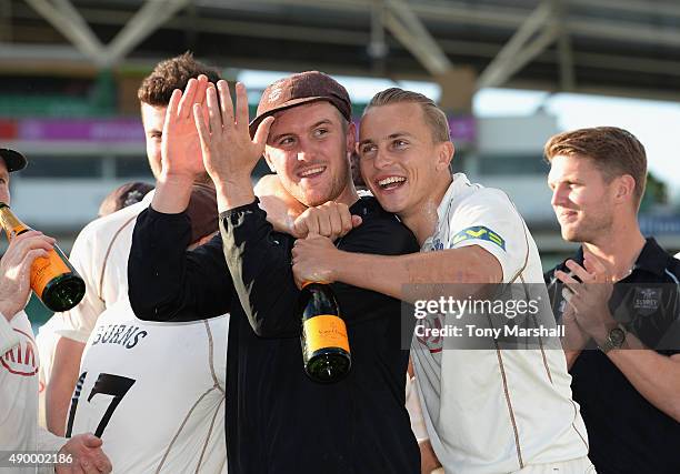 Jason Roy and Tom Curran of Surrey celebrate after winning of the Division 2 LV County Championship during the LV County Championship - Division Two...