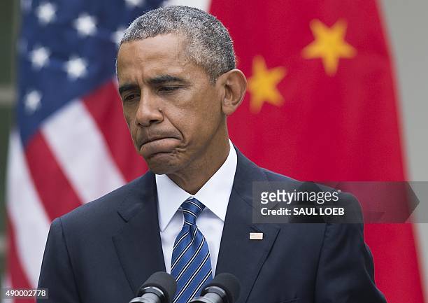 President Barack Obama speaks during a joint press conference with Chinese President Xi Jinping in the Rose Garden as part of a State Visit at the...