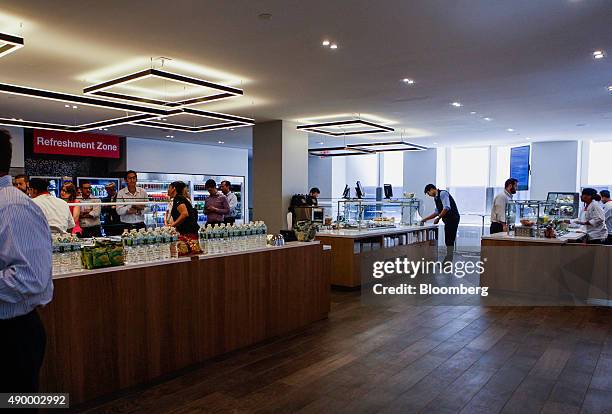 Employees get food during lunch in the cafeteria of the Societe Generale SA office in New York, U.S., on Monday, Sept. 14, 2015. Many of Wall...