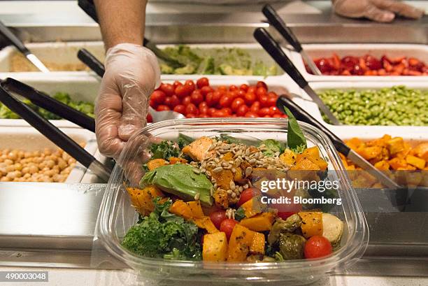 Salad is displayed for a photograph during lunch in the cafeteria of the Morgan Stanley office in New York, U.S., on Tuesday, Sept. 1, 2015. Many of...