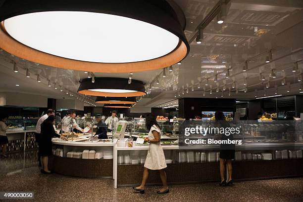 Employees browse food during lunch in the cafeteria of the Morgan Stanley office in New York, U.S., on Tuesday, Sept. 1, 2015. Many of Wall Street's...