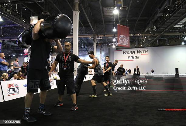 Fans participate in the uff fit Challenge at the UFC Fan Expo in the Sands Expo and Convention Center on July 10, 2015 in Las Vegas Nevada.