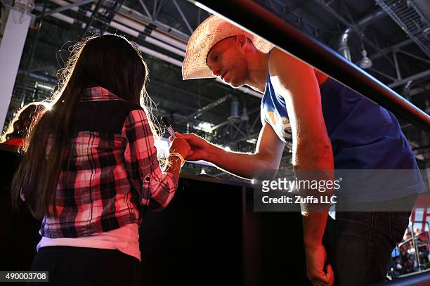 Donald Cerrone interacts with a fan at the UFC Fan Expo in the Sands Expo and Convention Center on July 9, 2015 in Las Vegas Nevada.
