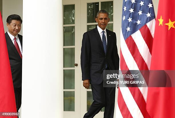 President Barack Obama and Chinese President Xi Jinping arrive for a joint-press conference in the Rose Garden as part of a State Visit at the White...