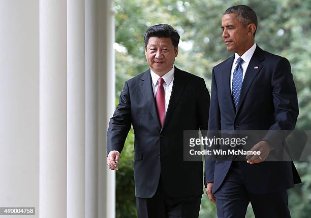 President Barack Obama and Chinese President Xi Jinping arrive for a joint press conference in the Rose Garden at The White House on September 25,...