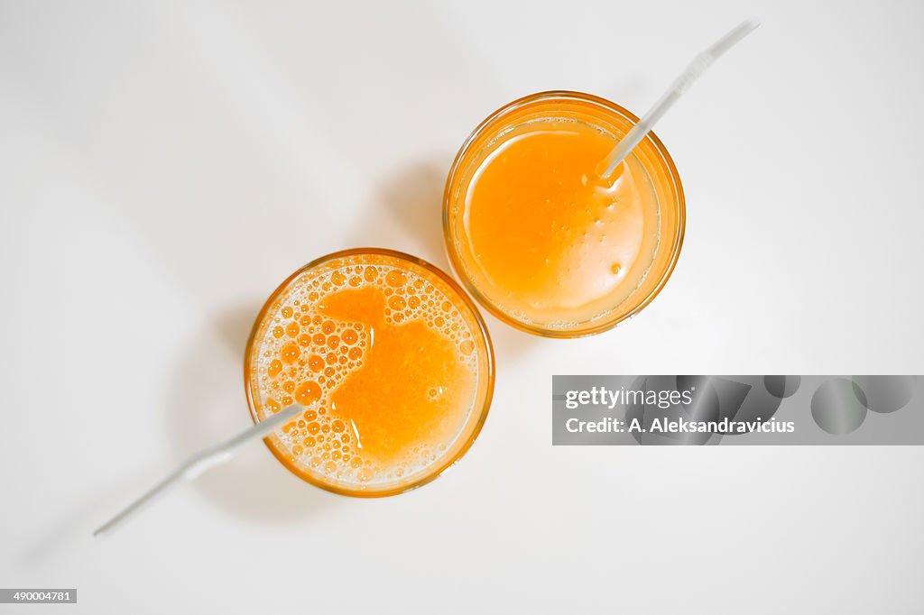 Top view of two glass orange fresh juice