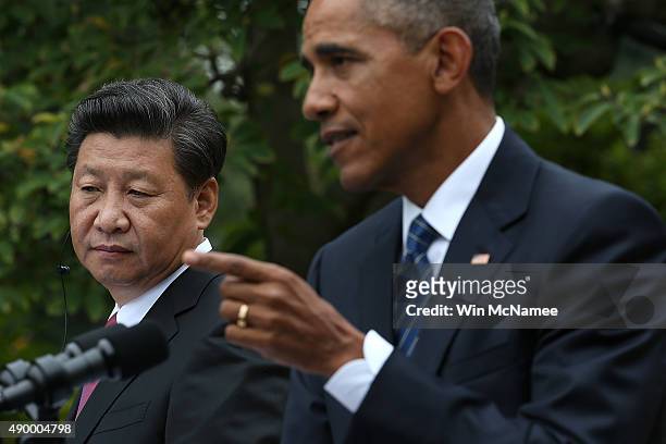 President Barack Obama and Chinese President Xi Jinping hold a joint press conference in the Rose Garden at The White House on September 25, 2015 in...