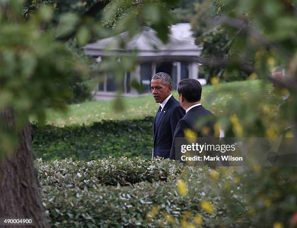 President Barack Obama and Chinese President Xi Jinping leave a joint news conference in the Rose Garden at The White House on September 25, 2015 in...