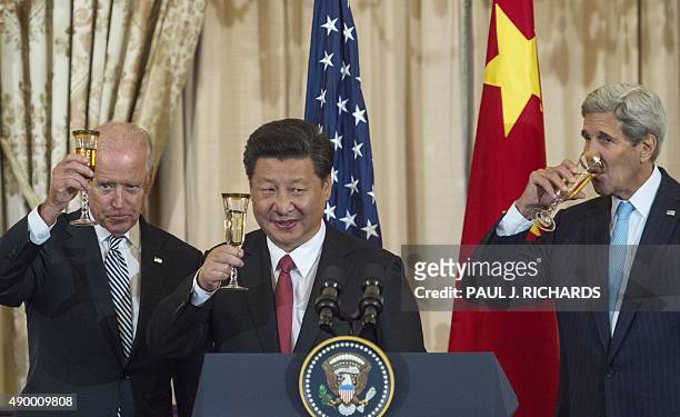 Vice President Joe Biden, Chinese President Xi Jinping and US Secretary of State John Kerry make a toast during a State Luncheon for China hosted by...