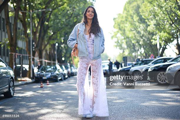 Sara Nicole Rossetto poses wearing an Understated Leather jacket, Charo Ruiz Ibiza Couture dress and Barbara Bonner bag before the Emporio Armani...