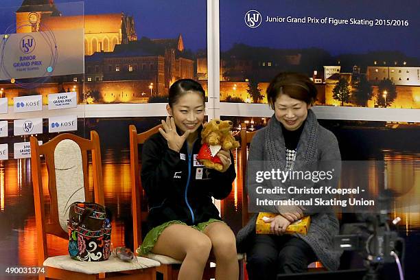 Rin Nitaya of Japan and her coach Yoriko Naruse celebrate the thrid place during the junior ladies free skating of the ISU Junior Grand Prix at...