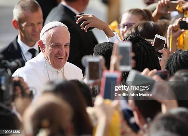 School children photograph Pope Francis after his arrival to the Lady Queen of Angels school on September 25, 2015 in the Harlem neighborhood of New...