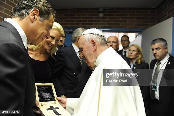 New York Governor Andrew Cuomo, along with his girlfriend Sandra Lee, give a gift to Pope Francis at Our Lady Queen of Angels School in East Harlem,...