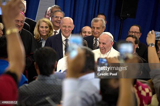 Pope Francis greets people at Our Lady Queen of Angels on September 25, 2015 in the neighborhood of East Harlem in New York City. Pope Francis is on...