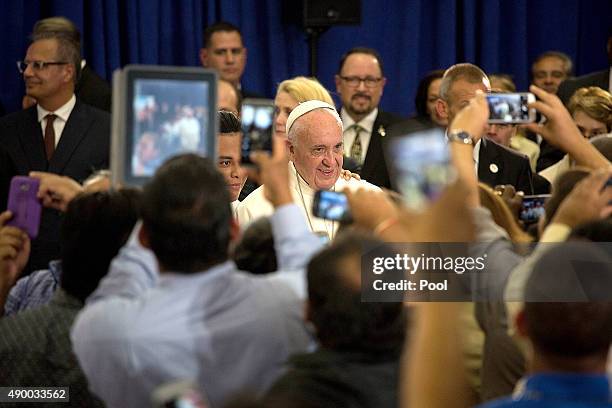 Pope Francis greets people at Our Lady Queen of Angels on September 25, 2015 in the neighborhood of East Harlem in New York City. Pope Francis is on...