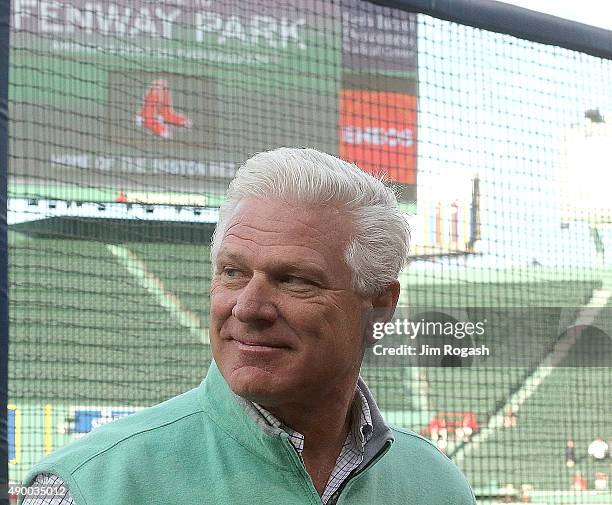 Frank Wren, who has been hired as the Boston Red Sox's vice president of baseball operations, smiles as he interacts with the media before a game...