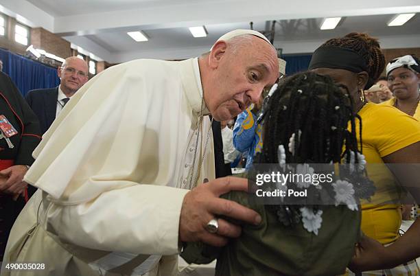 Pope Francis greets people inside Our Lady Queen of Angels School September 25, 2015 in the East Harlem neighborhood of New York City. Pope Francis...