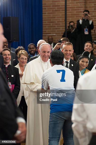 Pope Francis greets people inside Our Lady Queen of Angels School September 25, 2015 in the East Harlem neighborhood of New York City. Pope Francis...