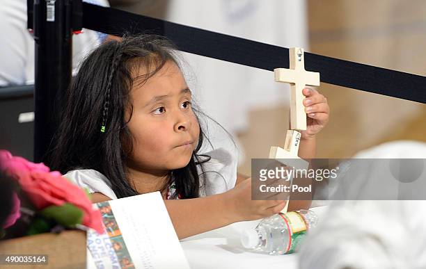 Yougn girl waits for Pope Francis at Our Lady Queen of Angels School in East Harlem, September 25, 2015 in New York City. Pope Francis is on a...