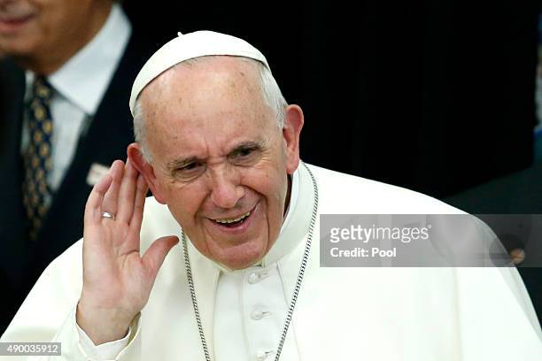 Pope Francis listens to children singing during a visit to Our Lady Queen of Angels School September 21, 2015 in the East Harlem neighborhood of New...