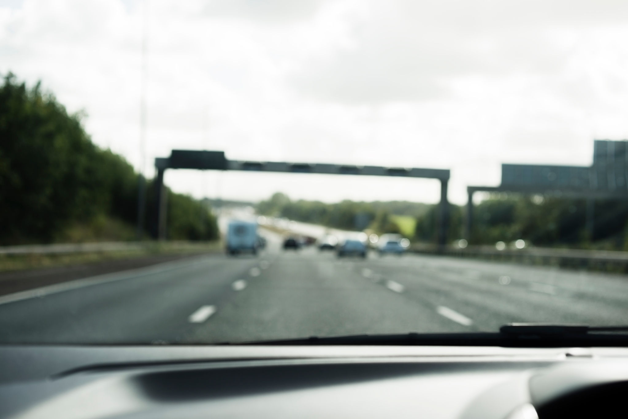 Defocused UK Motorway through car windscreen Defocused UK Motorway through car windscreen