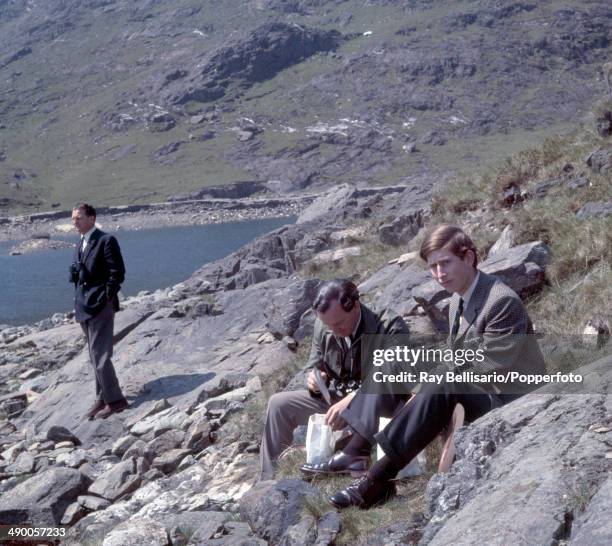 Prince Charles picnicking in the foothills of Mount Snowdon in north Wales on 5th June 1969.