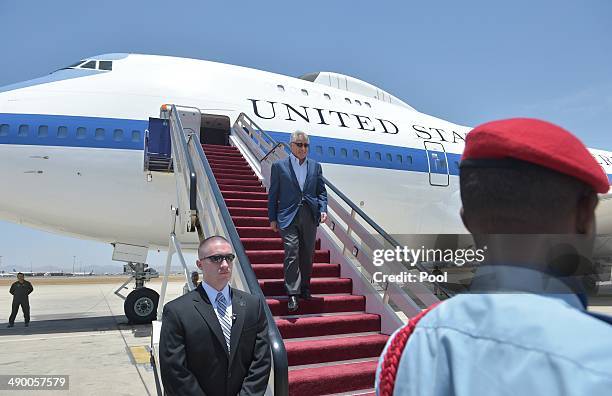 Defense Secretary Chuck Hagel makes his way from the plane upon his arrival at King Abdulaziz International Airport on May 13, 2014 in Jeddah, Saudia...