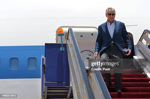 Defense Secretary Chuck Hagel makes his way from the plane upon his arrival at King Abdulaziz International Airport on May 13, 2014 in Jeddah, Saudia...