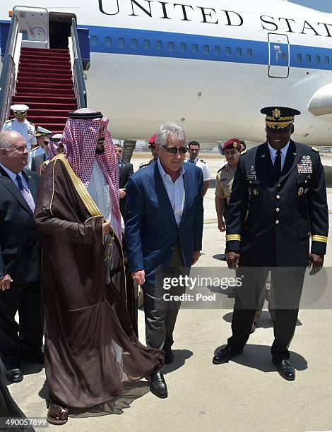 Defense Secretary Chuck Hagel is welcomed by Saudi Deputy Defense Minister Salman bin Sultan upon his arrival at King Abdulaziz International Airport...