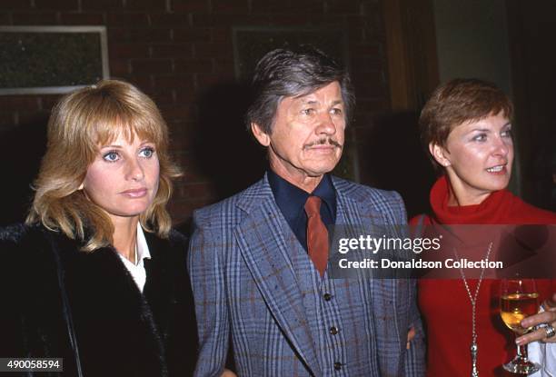 Actress Joanne Woodward attends an event with Charles Bronson and Jill Ireland in December 1980 in Los Angeles, California.