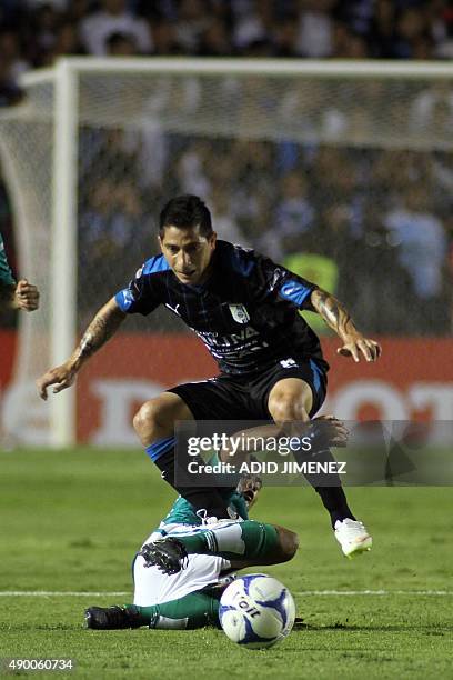 Danilo Veron of Queretaro vies for the ball with Jose Juan Vazquez of Leon, during their Mexican Apertura 2015 tournament football match, at the La...
