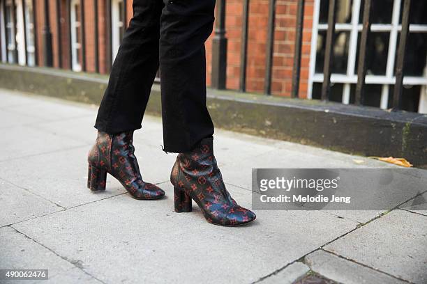 Teen Vogue editor Jessica Minkoff black Acne jeans and Louis Vuitton boots during London Fashion Week Spring Summer 2016 at on September 19, 2015 in...