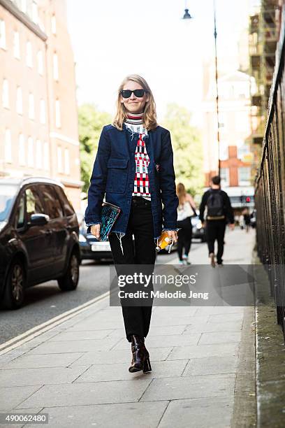 Teen Vogue editor Jessica Minkoff wears a personalized blue Zara jacket, Jonathan Saunders turtleneck, Acne jeans, Ray-Ban sunglasses, Proenza...