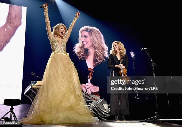 Singer/songwriters Taylor Swift and Alison Krauss perform onstage during The 1989 World Tour live in Nashville at Bridgestone Arena on September 25,...