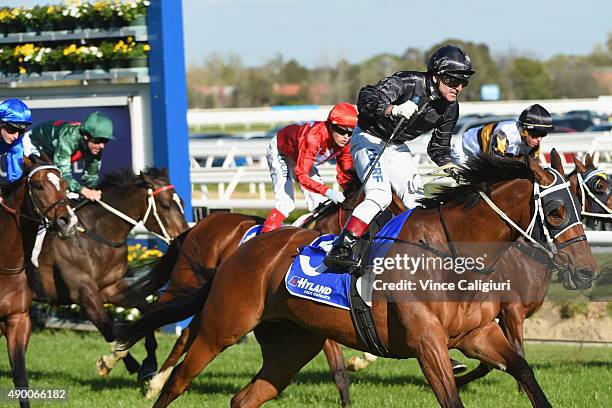 Vlad Duric riding Mourinho reacts after winning Race 7, the Underwood Stakes during Melbourne Racing at Caulfield Racecourse on September 26, 2015 in...