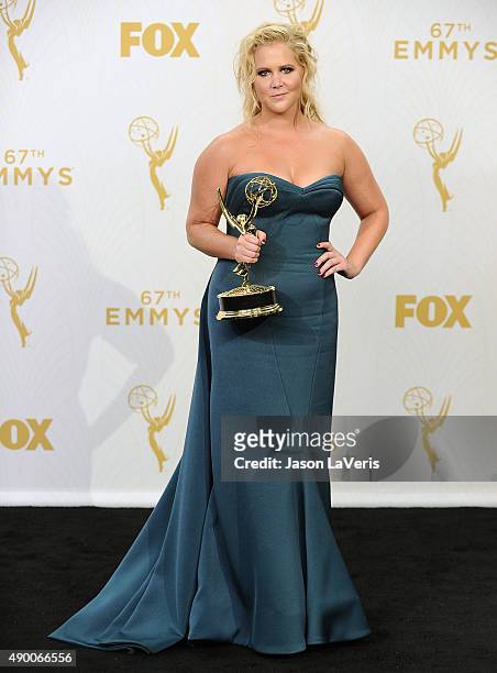 Actress Amy Schumer poses in the press room at the 67th annual Primetime Emmy Awards at Microsoft Theater on September 20, 2015 in Los Angeles,...