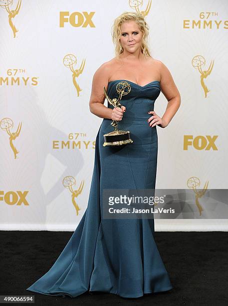Actress Amy Schumer poses in the press room at the 67th annual Primetime Emmy Awards at Microsoft Theater on September 20, 2015 in Los Angeles,...