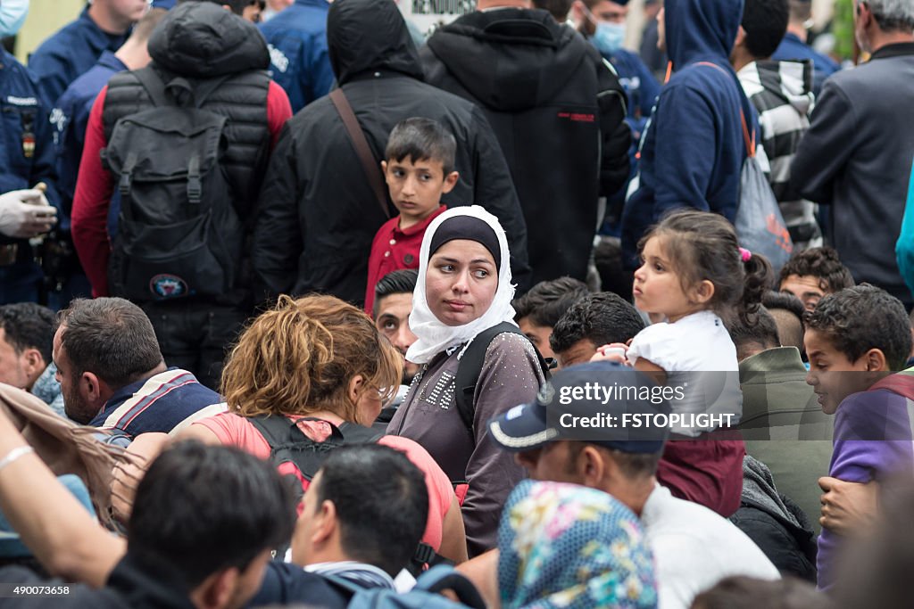 Refugees in the Keleti train station structure of Budapest city