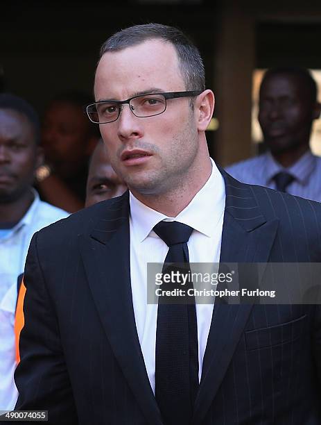 Oscar Pistorius leaves North Gauteng High Court after Judge Thokozile Masipa adjourned the days proceedings early on May 13, 2014 in Pretoria, South...