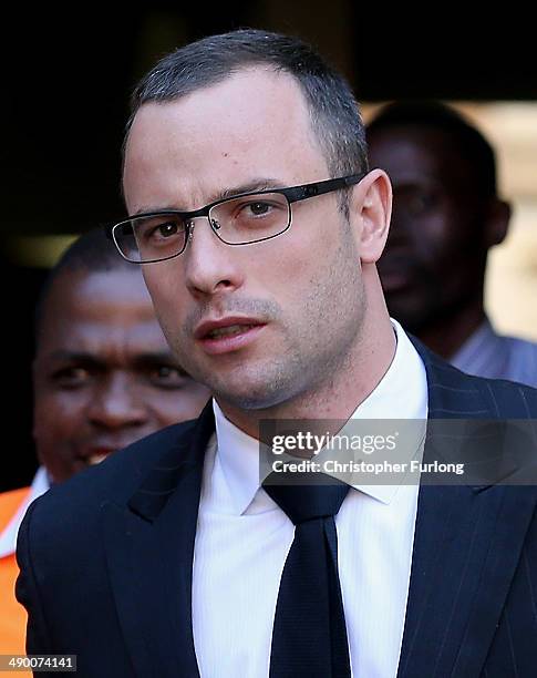 Oscar Pistorius leaves North Gauteng High Court after Judge Thokozile Masipa adjourned the days proceedings early on May 13, 2014 in Pretoria, South...