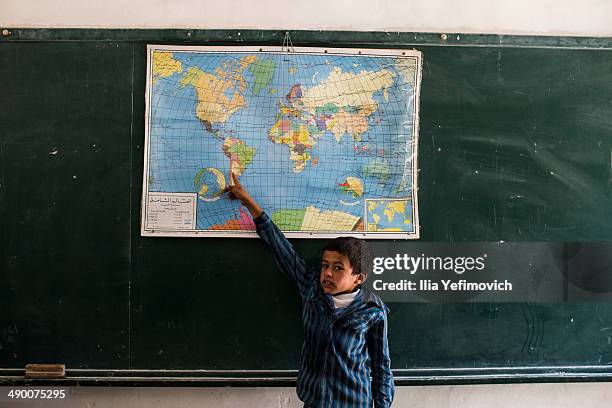 Pupil takes part in a classroom activity at a Palestinian Bedouin of Jahaline tribe school in the area of E1, not far from the settlement of Maale...
