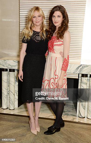Kirsten Dunst and Daisy Bevan pose at a photocall for "The Two Faces Of January" at Corinthia Hotel London on May 13, 2014 in London, England.